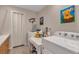 Functional laundry room featuring a washer, dryer, and utility sink at 29333 Rawhide Ct, Elizabeth, CO 80107