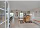 Open-concept living space with fireplace, abundant natural light, and seamless flow to the kitchen at 29333 Rawhide Ct, Elizabeth, CO 80107