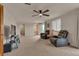 Open living room with neutral walls, ceiling fan, and comfortable seating at 29333 Rawhide Ct, Elizabeth, CO 80107