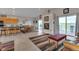 Open-concept living area boasts vaulted ceilings, a fireplace, and access to an outdoor deck at 29333 Rawhide Ct, Elizabeth, CO 80107