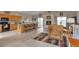 Spacious kitchen and living area with an island, providing ample seating and seamless entertainment at 29333 Rawhide Ct, Elizabeth, CO 80107