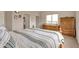 Spacious main bedroom featuring light walls, a window, and wooden furniture at 29333 Rawhide Ct, Elizabeth, CO 80107
