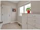 Mud room area with natural light and tile flooring, offering outdoor views at 29333 Rawhide Ct, Elizabeth, CO 80107