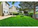 This home's backyard features a manicured lawn, mature trees, and a patio at 3151 E 134Th Cir, Thornton, CO 80241