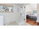 Bathroom boasts a glass-enclosed shower with marble wall surround and bedroom view at 3151 E 134Th Cir, Thornton, CO 80241