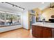 Eat-in kitchen area features a large window and sliding glass door to patio at 3151 E 134Th Cir, Thornton, CO 80241