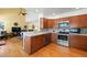 Traditional kitchen featuring light wood cabinetry, stainless steel appliances, and light countertops at 3151 E 134Th Cir, Thornton, CO 80241