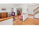 Open concept living room boasting hardwood floors and staircase to upper level at 3151 E 134Th Cir, Thornton, CO 80241