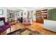 Spacious living area with hardwood floors, a dining area, and an open staircase at 3151 E 134Th Cir, Thornton, CO 80241