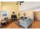 Bright living room with vaulted ceilings, ceiling fan, hardwood floors, and comfortable seating at 3151 E 134Th Cir, Thornton, CO 80241