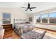 Bright main bedroom with large windows and a ceiling fan for comfortable living at 3151 E 134Th Cir, Thornton, CO 80241