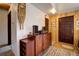 Entryway featuring a wooden front door, and decorative furnishings at 10042 Buena Vista Dr, Conifer, CO 80433