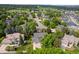 Aerial view of a residential neighborhood with lush greenery and well-maintained homes at 4161 W Lake Cir, Littleton, CO 80123
