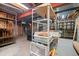 Unfinished basement storage with exposed ductwork and shelving at 4161 W Lake Cir, Littleton, CO 80123
