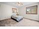 Bedroom with neutral carpet, a double bed and a window to the back yard at 4161 W Lake Cir, Littleton, CO 80123