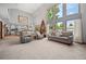 Open concept living area featuring vaulted ceiling, neutral tones, and seamless flow into the kitchen at 4161 W Lake Cir, Littleton, CO 80123