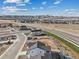 This expansive view shows the community nestled against a backdrop of rolling mountains at 8950 Whiteclover St, Littleton, CO 80125