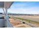 Scenic balcony view showcasing the community, mountains, and the open landscape at 8950 Whiteclover St, Littleton, CO 80125