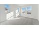 Sunlit bedroom featuring neutral carpet and several windows at 8950 Whiteclover St, Littleton, CO 80125
