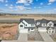 Charming two-story home featuring a two-car garage and a well-manicured front yard at 8950 Whiteclover St, Littleton, CO 80125