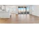 Inviting living room with hardwood floors, large glass doors, and seamless connection to the outdoors at 8950 Whiteclover St, Littleton, CO 80125