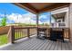 Back porch with grill, great for outdoor dining, and enjoying a view of the backyard on a summer day at 16432 Snowbourn Dr, Parker, CO 80134