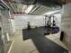 Finished basement transformed into a home gym with modern equipment and ample workout space at 16432 Snowbourn Dr, Parker, CO 80134