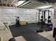Basement transformed into a home gym featuring modern equipment and durable flooring at 16432 Snowbourn Dr, Parker, CO 80134