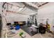 Unfinished basement area featuring a home gym with exercise equipment and ample storage space at 16432 Snowbourn Dr, Parker, CO 80134