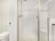 Modern bathroom showcasing a glass-enclosed shower with tiled walls and a built-in seat for a spa-like experience at 16432 Snowbourn Dr, Parker, CO 80134