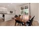 Inviting dining area with view of the kitchen with stainless steel appliances at 16432 Snowbourn Dr, Parker, CO 80134
