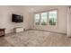 Cozy living room filled with natural light, features an area rug and wood flooring at 16432 Snowbourn Dr, Parker, CO 80134