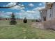 Sprawling backyard featuring a stone patio with outdoor seating at 22921 E Euclid Cir, Aurora, CO 80016