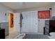 Bedroom with neutral paint, a ceiling fan, a large closet, and a red accent blanket at 22921 E Euclid Cir, Aurora, CO 80016