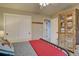 Bedroom featuring a bed, a ceiling fan, an accent blanket, and decorative storage at 22921 E Euclid Cir, Aurora, CO 80016