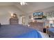 Bright bedroom with comfortable bed, hardwood furniture, and natural light at 22921 E Euclid Cir, Aurora, CO 80016