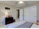 Bedroom with closet and dresser, a comfy bed, and neutral decor for a calm atmosphere at 22921 E Euclid Cir, Aurora, CO 80016