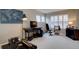 Comfortable bedroom featuring natural light, exercise equipment, and ample space at 22921 E Euclid Cir, Aurora, CO 80016