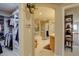 Hallway view shows a walk-in closet and leads to the bathroom with a soaking tub at 22921 E Euclid Cir, Aurora, CO 80016