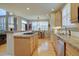 Modern kitchen with wood cabinets, granite countertops, hardwood floors, and stainless steel appliances at 22921 E Euclid Cir, Aurora, CO 80016