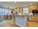 Kitchen with breakfast nook featuring light cabinets, granite countertops, stainless appliances, and natural light at 22921 E Euclid Cir, Aurora, CO 80016
