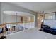 Spacious upstairs landing with white railings overlooking the downstairs living space with an open floor plan at 22921 E Euclid Cir, Aurora, CO 80016