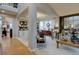 Open-concept home with multiple living areas featuring stylish decor and ample natural light at 22921 E Euclid Cir, Aurora, CO 80016