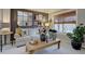 Comfortable living room features a cozy sofa, large window, and decorative accents at 22921 E Euclid Cir, Aurora, CO 80016