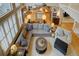Open living room with hardwood floors, large windows, and modern decor and furnishings perfect for entertaining at 22921 E Euclid Cir, Aurora, CO 80016