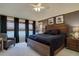 Relaxing main bedroom featuring a plush bed, natural light, and tasteful decor at 22921 E Euclid Cir, Aurora, CO 80016