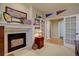 Stylish office space featuring a fireplace and French doors, ideal for working from home at 22921 E Euclid Cir, Aurora, CO 80016