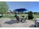 Inviting patio area with an umbrella and seating, ideal for enjoying outdoor relaxation at 22921 E Euclid Cir, Aurora, CO 80016