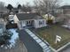 Aerial view of home showcasing the front yard and gravel driveway at 2665 S Pennsylvania St, Denver, CO 80210