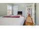 Serene bedroom features hardwood floors, natural light, and a view into the hallway at 2665 S Pennsylvania St, Denver, CO 80210